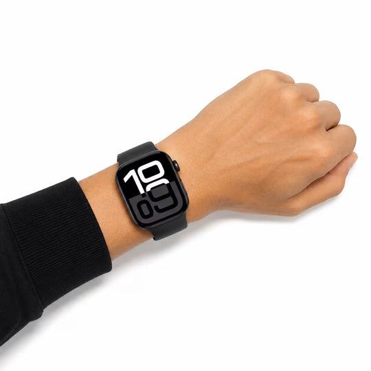 A black smartwatch with a rectangular digital display showing the time 10:00, worn on a person's wrist against a plain white background.